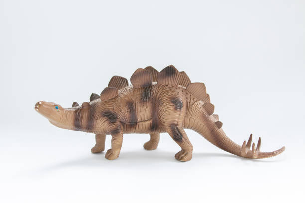 istock toy dinosaur on a white background 1225978276