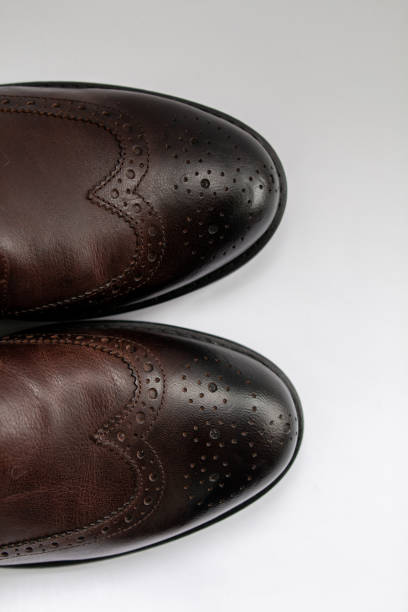istock brown men’s shoes on a white background 1225979017