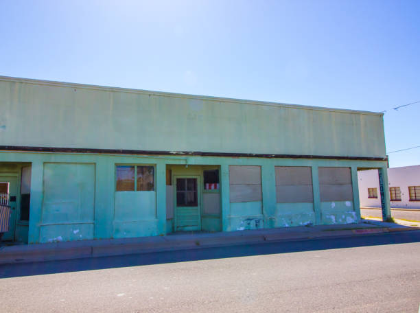 istock Abandoned Corner Building With Boarded Up Windows 1225982613