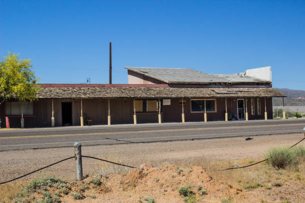istock Abandoned Long Roadside Building In Disrepair 1225982627