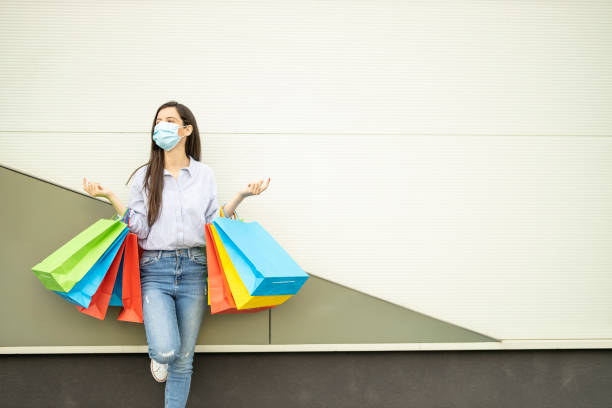 istock Woman wearing protective face mask and shopping 1225983611