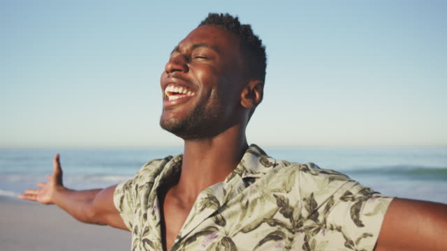 African American man enjoying the fresh air at the beach