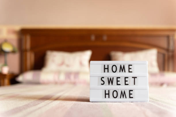 istock Lightbox with text: home sweet home on bed. 1225989828