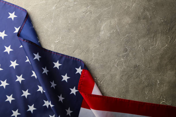 istock American flag on grey concrete background with copy space 1225992194