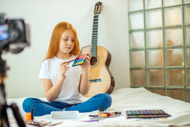 istock enthusiastic little blogger show cosmetics at camera 1225994253