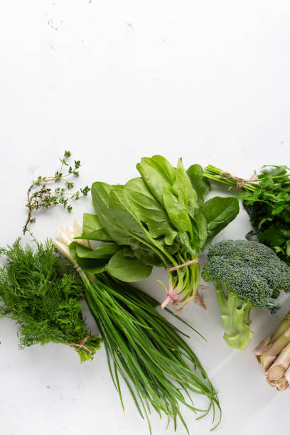 istock Bunches of fresh green herbs and veggies 1225997779