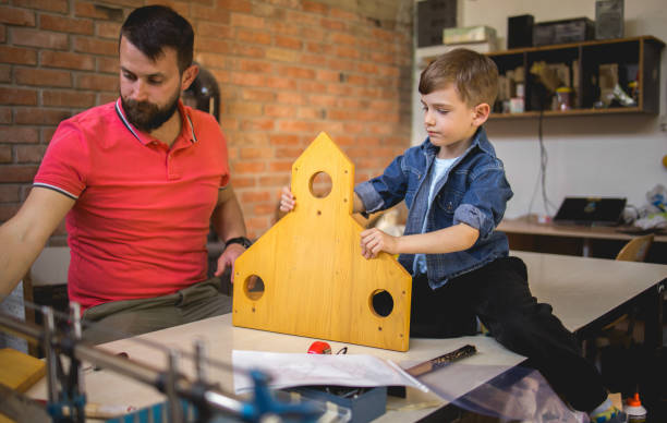istock Father and Son Making a Birdhouse 1225999037