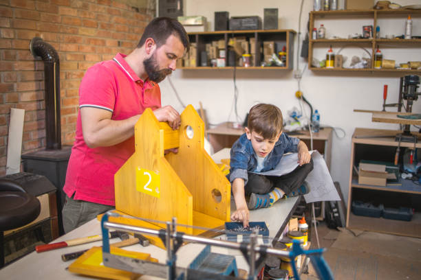 istock Father and Son Making a Birdhouse 1225999108
