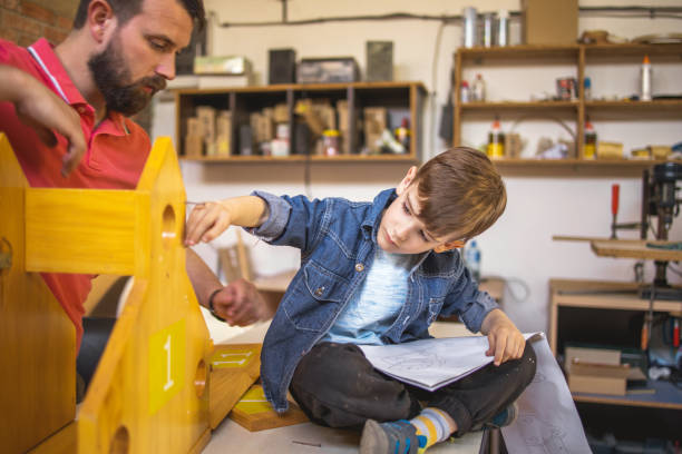 istock Father and Son Making a Birdhouse 1225999207