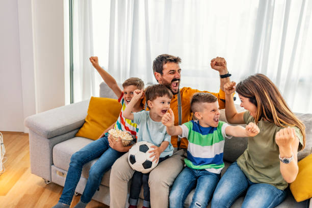 Excited family watching television