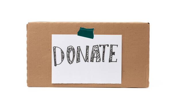 istock brown cardboard box with a pasted white sheet and the inscription donate 1226002892