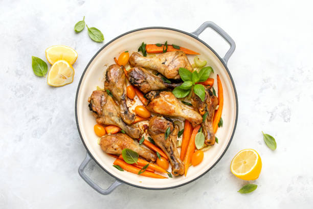 istock Chicken drumsticks slow cooked in a cast iron pan 1226003503
