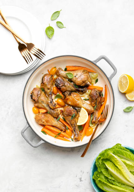 istock Chicken drumsticks slow cooked in a cast iron pan 1226003518