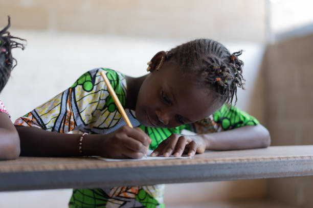 istock Gorgeous African Ethnicity Girls Writing Studying Learning Together 1226003639