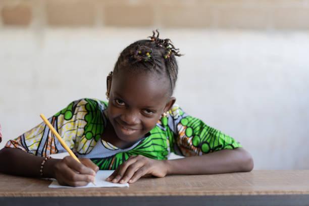 istock Cute African Black Girl Learning Her Lesson in School 1226003642