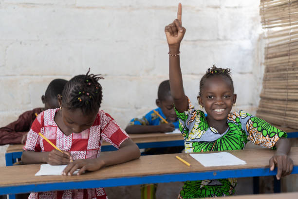 istock African School Children Raising Their Hands during Lesson. 1226004329