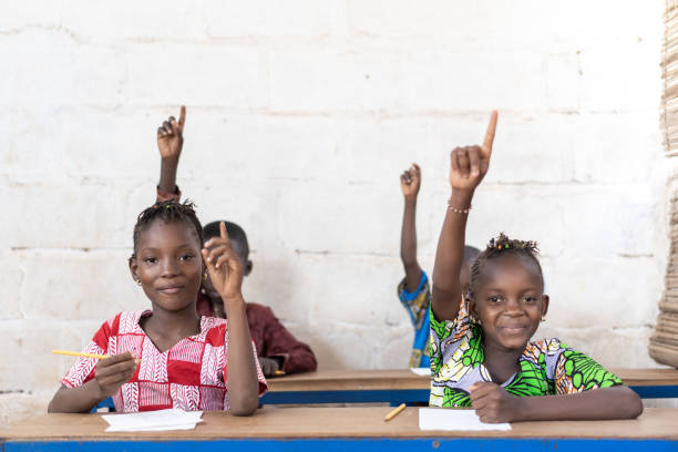 Slight Smile African Black Ethnicity School Girl. Candid picture of African children in a School Building.