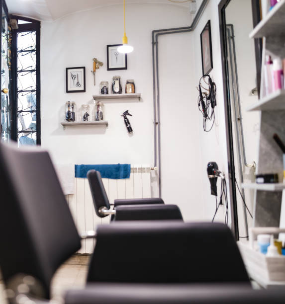 istock Empty hair salon interior with chairs and mirrors. 1226009507