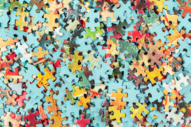istock Bright puzzle pieces textured paper 1226009522