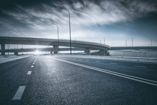 istock Clear blue sky and white clouds in the background, highway overpass curved approach bridge 1226009617