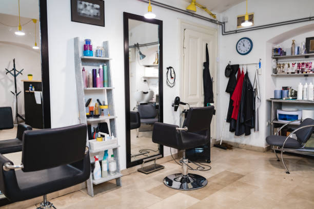 istock Empty hair salon interior with chairs and mirrors. 1226009665