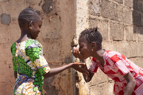 istock Gorgeous Girls Drinking Water Together - Human Rights Symbol 1226009666