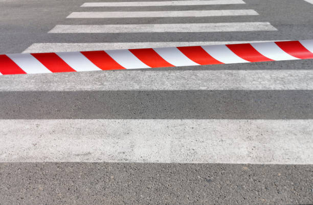 istock pedestrian crossing closed by tape, no entry, passage closed, lockdown 1226011288