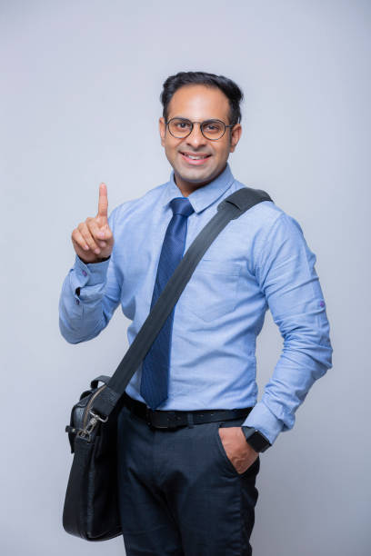 young indian businessman - stock images - number 1 businessman one finger one person imagens e fotografias de stock