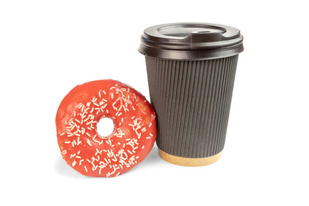 istock Pink Doughnut cut out standing on white background with take away coffee cup of chocolate color. 1226019904
