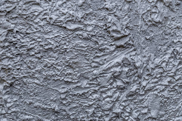 istock Abstract silver color painted on grunge rough surface of stucco concrete wall. Good for texture background and wallpaper 1226020938