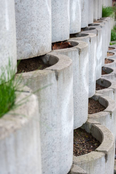 istock Garden wall formed of cylindrical containers 1226022083