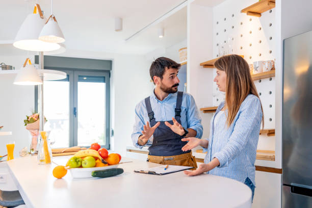 istock Technician Showing Invoice To Shocked Woman 1226023674