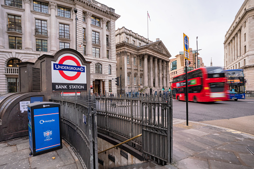 London, UK - December 16, 2019: The Bank of England during the day at Bank Junction showing buildings and London double-decker public bus.