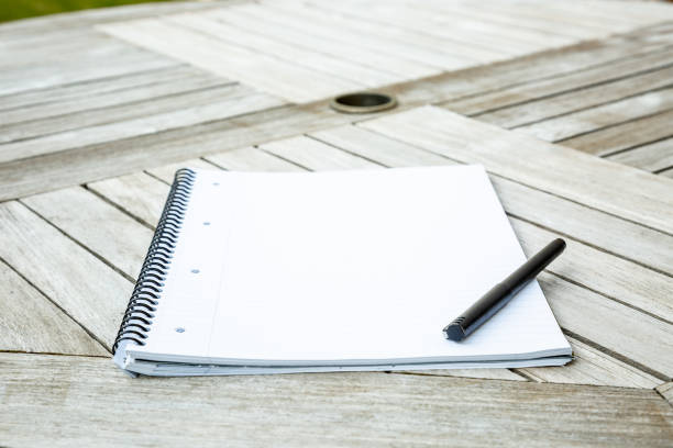 istock Writing pad and pen on a garden table 1226025664