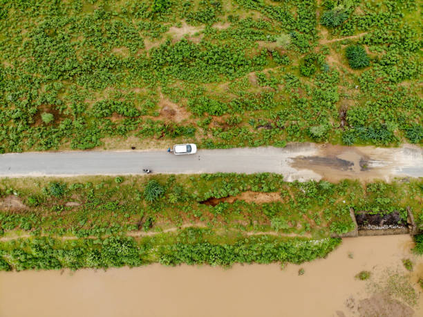 istock Aerial view of a road through green fields. 1226025748
