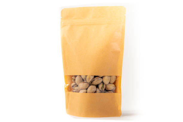 istock kraft paper doypack pouch flexible packaging with window zipper on white background filled with pistachios 1226027045