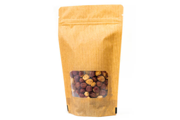 istock stripped paper doypack food packaging, bag filled with hazelnuts with window and zipper on white background 1226027133
