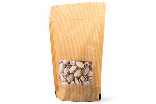 istock stripped paper doypack pouch filled with dry fruit, flexible packaging with window zipper on white background 1226027240