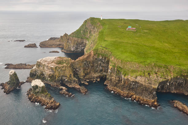 istock Mykines lighthouse and cliffs on Faroe islands from helicopter 1226027433