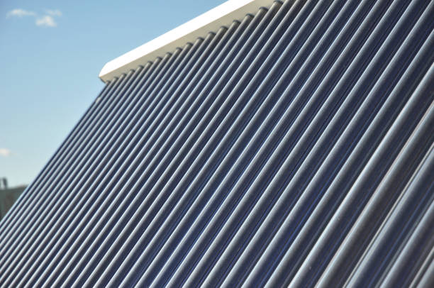 istock Close up on solar water panels heating glass tubes textured background. 1226028521