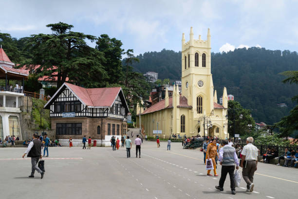 Christ Church and people walking along the Mall. Shimla, India. Shimla, India - August 3O, 2019: Christ Church and neighbouring buildings and people promenading along the popular mall with hills as backdrop on August 30, 2019 in Shimla, Himachal Pradesh, India. shimla stock pictures, royalty-free photos & images