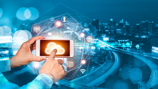 istock Businessman hand touch finger on smartphone screen with blurred city background. Digital connection at clouds services. 1226039653
