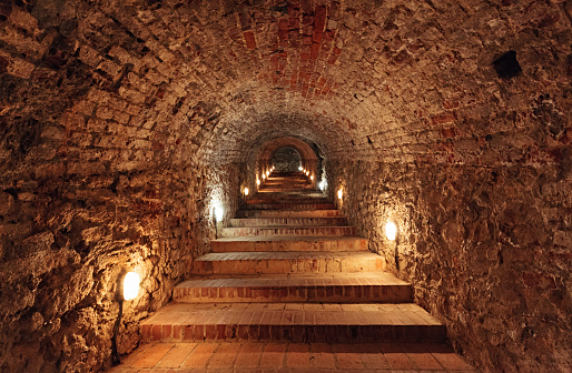 Dark staircase inside underground tunnel