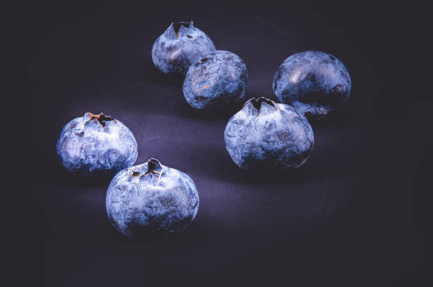 Group of blueberries on black background