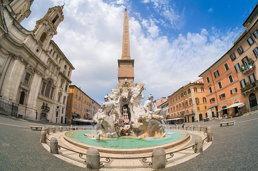 Rome, Italy, May 18 -- A view of Piazza Navona with the monumental Fontana dei Quattro Fiumi (Fountain of the Four Rivers) built by the sculptor and architect Gian Lorenzo Bernini between 1648 and 1651, and the church of Sant'Agnese in Agone built in 1652 by Francesco Borromini. Image in HD format.