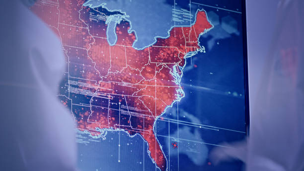 istock Scientists looking at screen with Eastern USA outbreaks. Futuristic Research Laboratory 1226043975