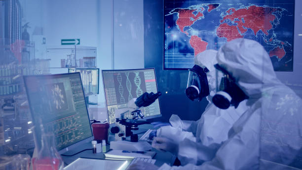 istock Multi ethnic scientists in futuristic laboratory. Infections on world map. Very high infectivity 1226044083