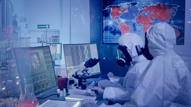 istock Multi ethnic scientists in futuristic laboratory. Infections on world map. Very high infectivity 1226044089