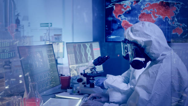 istock Multi ethnic scientists in futuristic laboratory. Infections on world map. Very high infectivity 1226044175