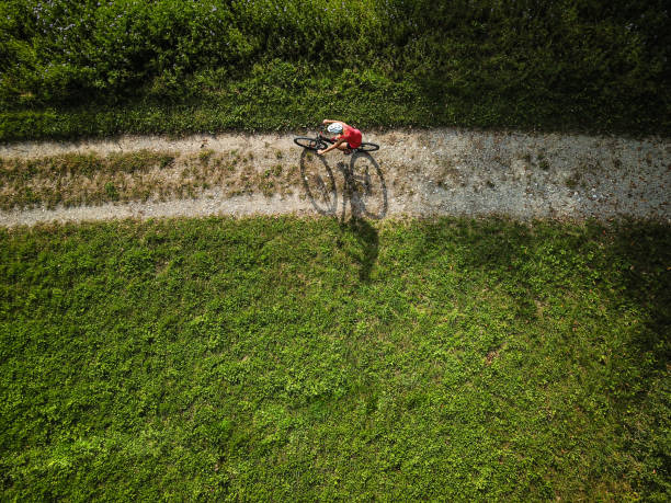 istock Pretty, young woman riding her mountain bike on a forest path 1226045549